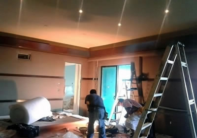 Upholsterers working for a commercial wall